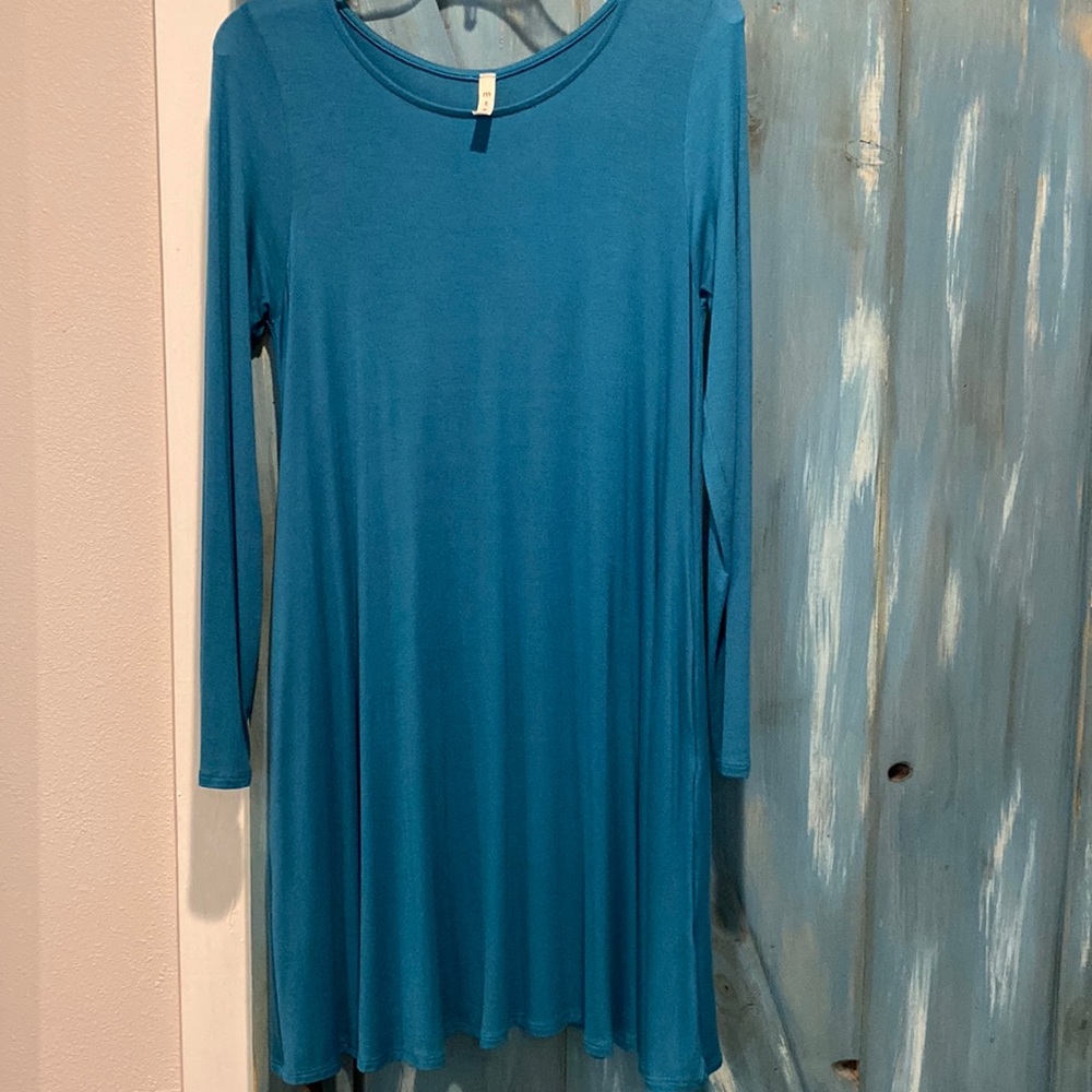 Long sleeve teal jersey knit swing dress with pockets